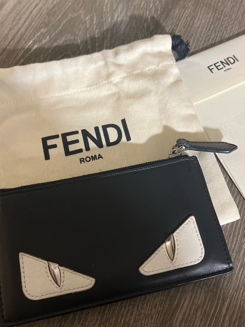 Fendi Black Wallet with Cream Eye Accents